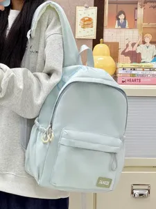 Detailed view of casual light blue student backpack, large capacity campus style book bag.