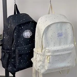 Detail shot of stylish star print canvas backpack with large capacity for daily school use.