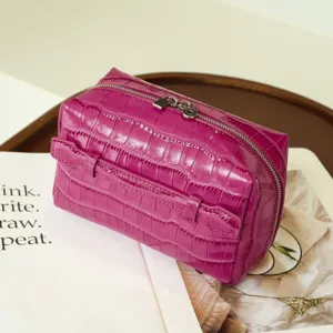 Detailed view of the purple crocodile pattern leather cosmetic bag, large capacity travel pouch.
