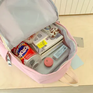 Pink minimalist large capacity student backpack, spacious interior detail showing daily use.
