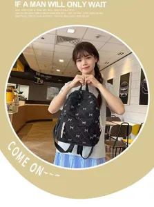 Korean style grid backpack for women, casual bow school bag with front pocket design.