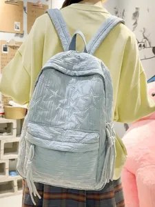 Sac à dos décontracté pour femme bleu clair matelassé d'étoiles, grande capacité pour le quotidien.