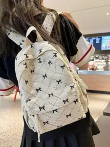 Korean style corduroy backpack with cute black bow embroidery, casual plaid school bag for women.