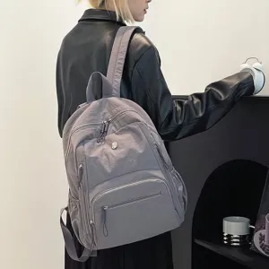 Casual minimalist backpack, large capacity student school bag, lightweight travel daypack.