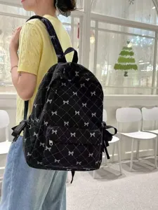 Korean style black corduroy backpack with bow pattern, large capacity daily school bag for women.