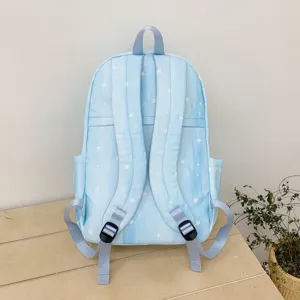 Detailed back view of a light blue student backpack featuring a cute white stars pattern and adjustable straps.