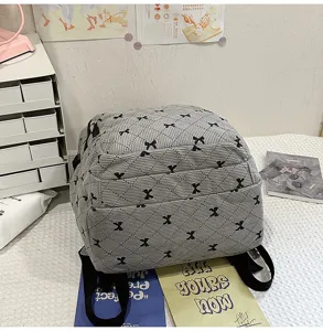 Detailed view of the cute quilted bow backpack, sweet Korean style student casual school bag.