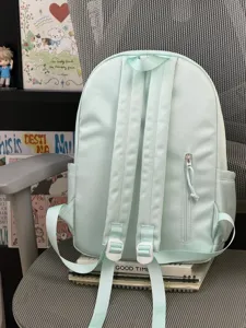 Sac à dos d'étudiant vert menthe uni minimaliste avec poche zippée à l'arrière et bretelles