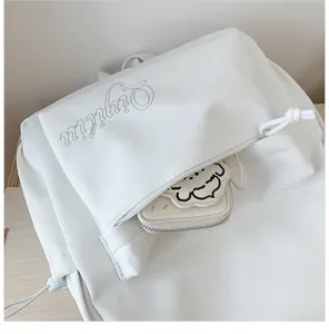 White canvas backpack with front zipper pocket, cute cartoon dog coin purse, casual student daypack