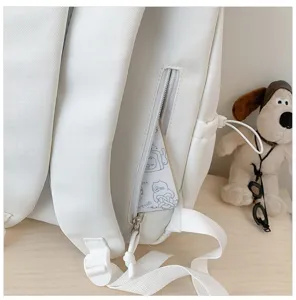 White backpack detail shot showing zipper pocket and cute design, perfect for student daily use.