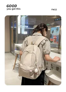 Detailed shot of Japanese minimalist solid color canvas backpack in beige, daily casual commute.