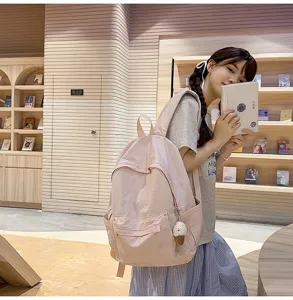Japanese style solid color backpack for women, simple versatile large capacity student schoolbag.