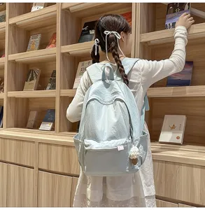 Minimalist solid color student backpack, large capacity casual daily commuter school bag.