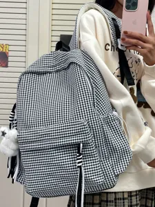 Black and white gingham backpack, large capacity casual plaid student schoolbag for daily commuting.