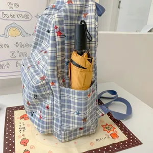 Korean style blue plaid backpack detail view with cute stars and practical side pocket for daily.