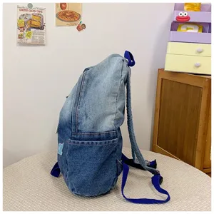 Sac à dos en denim décontracté pour étudiants, grande capacité, design élégant pour le quotidien.