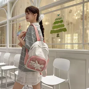 Cute star print itabag canvas backpack with transparent front pocket and bunny plush toy for students.