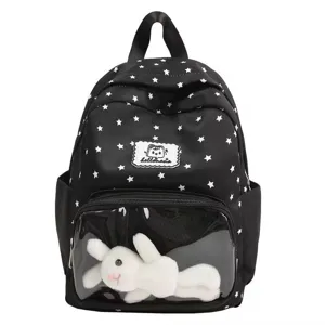 Black star print mini backpack with clear front pocket and cute plush toy insert for daily use.