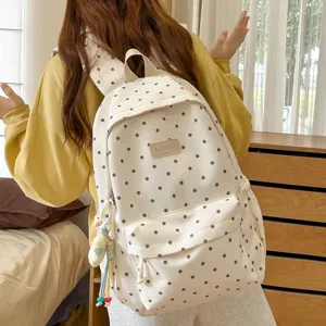 Korean style polka dot backpack for women, large capacity cute school bag for daily use.