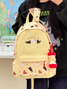 Cute cartoon cat canvas backpack for women, stylish student school bag with apple pendant.