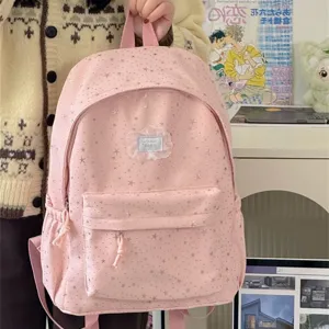 Cute pink star print canvas backpack for women, large capacity student school bag casual chic.