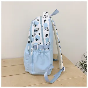 Cute cartoon print canvas backpack with large capacity, perfect for daily student use and travel.
