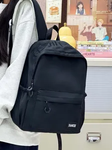 Casual black backpack for women, large capacity minimalist school bookbag for daily commute.