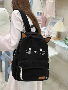 Cute black corduroy cat backpack for women, casual school bag with ears and embroidery daily use.