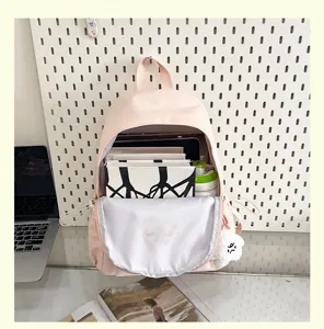 Pink casual large capacity backpack for women, stylish student school bag with multi compartments.