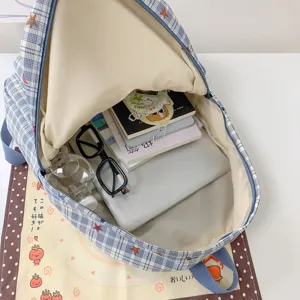 Korean style blue plaid school backpack with large capacity and cute star patterns.