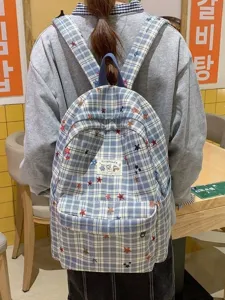 Cute plaid student school backpack with star embroidery, large capacity casual daypack for women.