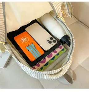 Korean ins striped backpack interior detail showcasing large capacity for books, phone and items.