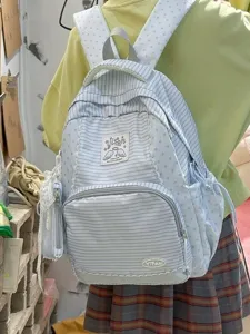 Sweet style striped backpack with lace trim, large capacity school bag for daily use.