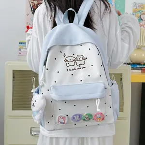 Sac à dos mignon japonais à pois avec poche avant transparente et pendentif en peluche.