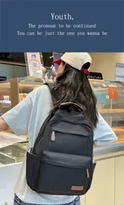 Zaino casual nero da donna, grande capacità borsa scolastica minimalista per uso quotidiano.