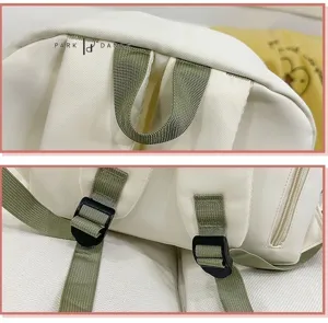 Close-up detail view of the canvas backpack straps, hanging loop, and adjustable buckles.
