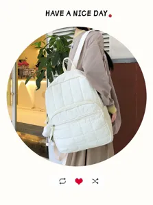 Detail view of the white quilted casual backpack featuring large capacity and soft material.