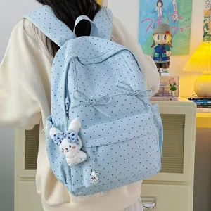 Japanese style polka dot canvas school backpack with cute bow and large capacity for daily use.