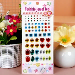 Detailed close-up view of colorful acrylic rhinestone face and phone stickers in shapes.