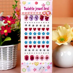 Acrylic rhinestone stickers detail view, showing various shapes like hearts, flowers, and gems.