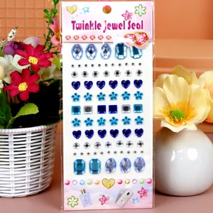 Blue acrylic rhinestone sticker sheet featuring mixed star heart plum shapes. Detail view.