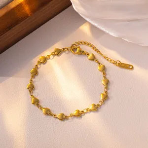 Minimalist heart-link titanium steel bracelet, elegant gold finish for women daily wear.
