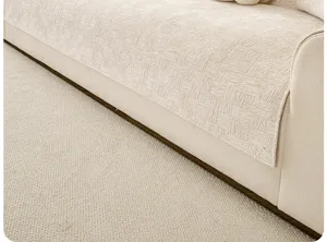 Cream chenille sofa cover detail texture, soft minimalist home textile cushion slipcover.