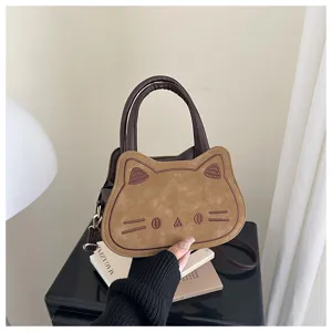 Cute cat shape shoulder bag detail, brown suede texture design, stylish daily crossbody bag.