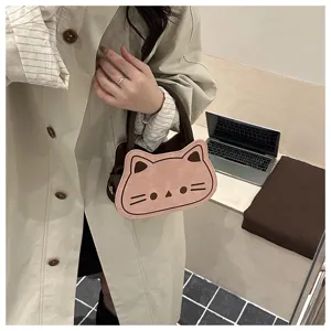 Detailed view of cute cat-shaped shoulder bag in pink and brown, daily lifestyle fashion.