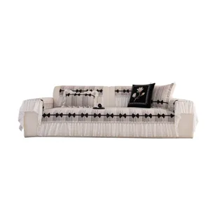 Chenille sofa cover with elegant ruffles and black bows, anti-slip design for living room decor.