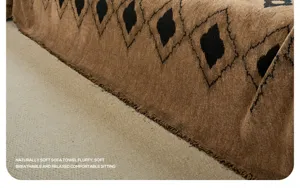 Close-up of retro geometric textured thick sofa cover blanket with stylish fringe.