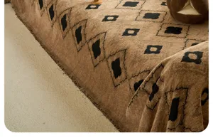 Thickened fluffy yarn sofa cover detail, retro brown geometric diamond pattern texture.