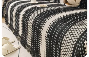 Black and white geometric chenille sofa cover throw blanket with fringe design for home decor.