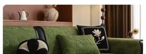 Detail view of the luxury mid-century modern green chenille sofa cover fabric texture.